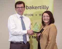 Award of Excellence – Key Auto Group: Joel Martinuk of Key Auto Group accepts the Award of Excellence presented by Kami De Pape of Suncrest College.